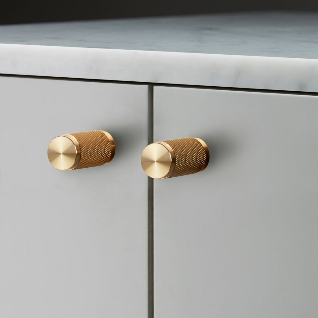 The BUSTER + PUNCH CROSS brass cupboard knob