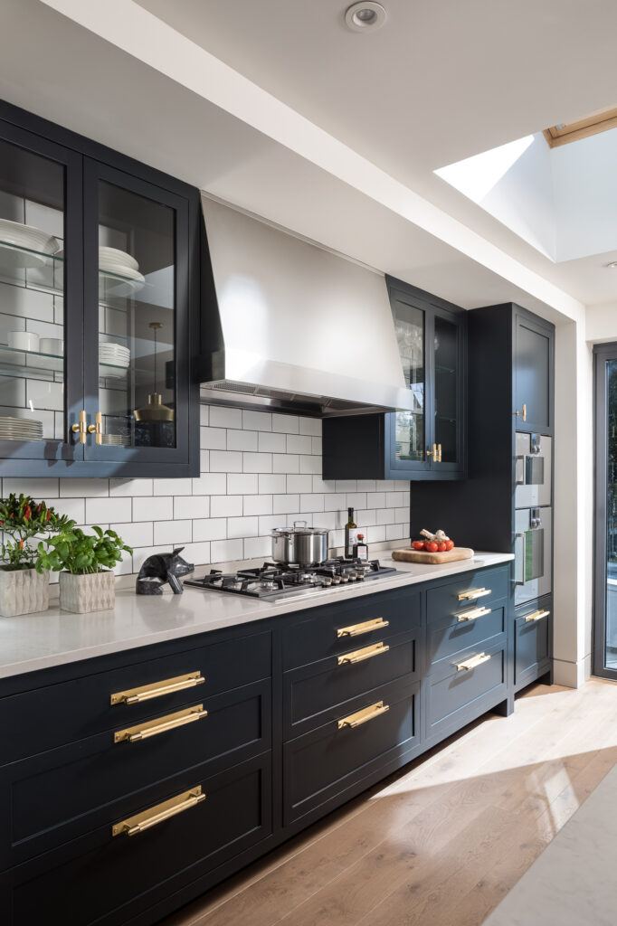 Buster + Punch Cross Collection in Brass on Blue Kitchen.
Many products in the cross collection by Buster + Punch are available at More Handles for Next-Day Delivery.