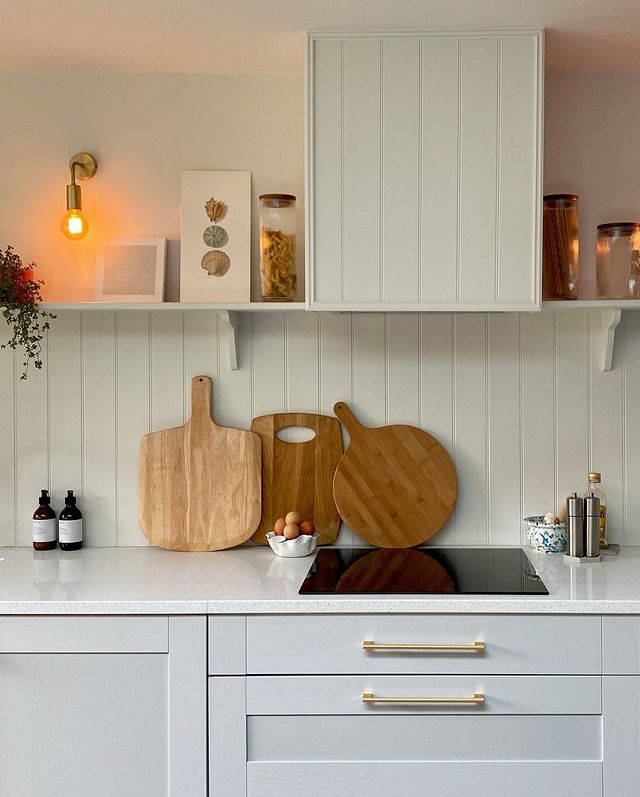 A traditional panelled kitchen with brass hardware 