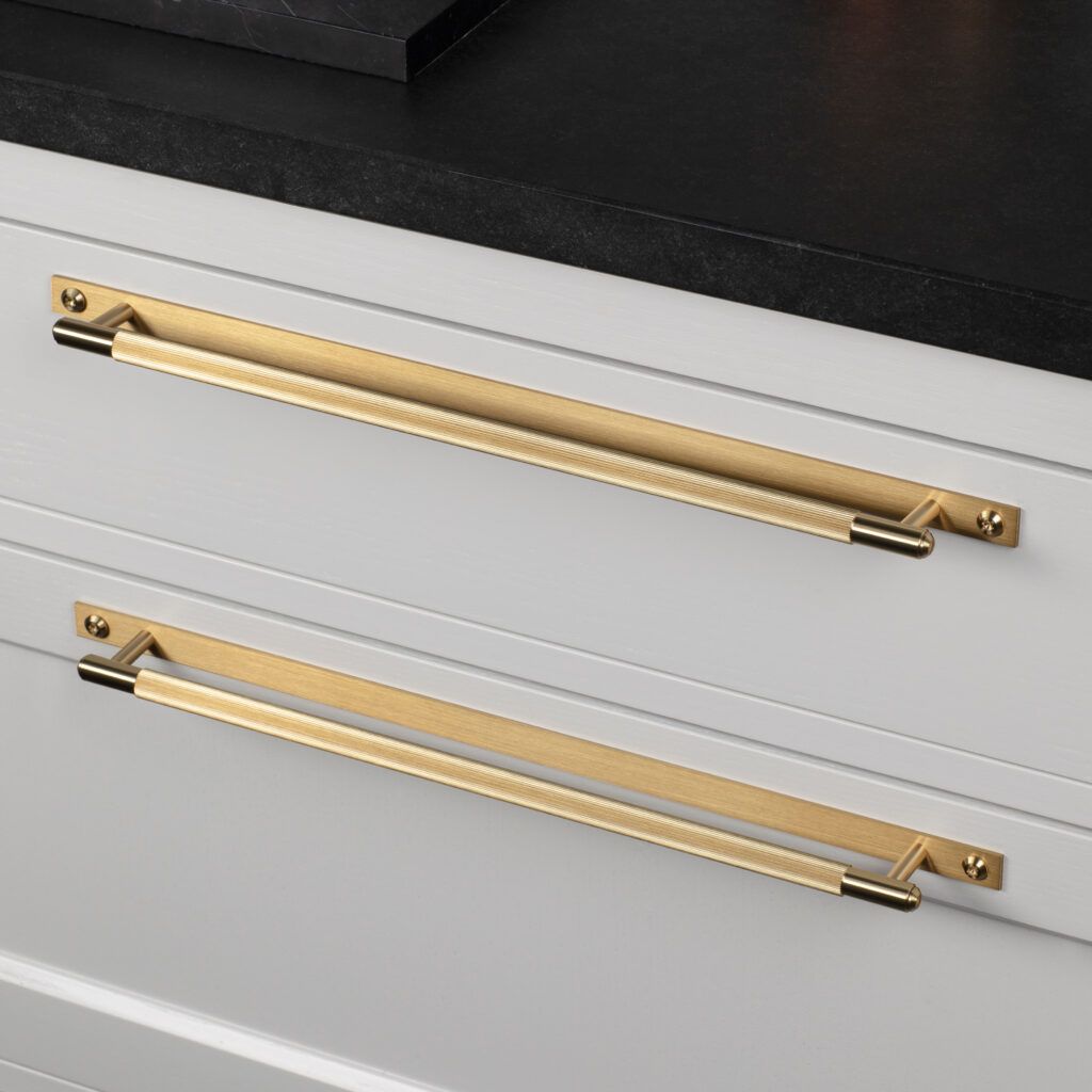 The BUSTER + PUNCH Brass LINEAR cupboard handles on backplate.