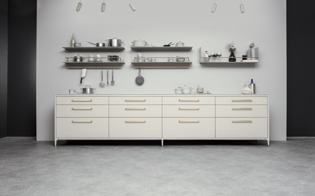 Brass Linear cupboard handles by BUSTER + PUNCH on neautral modern kitchen with open shelving.