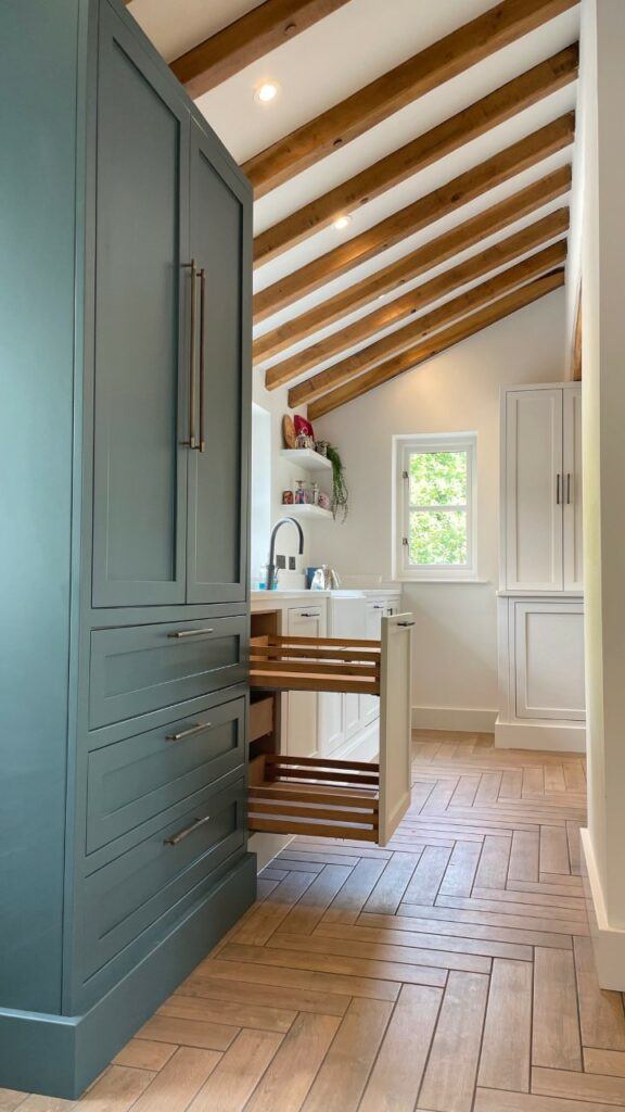 @jlbespokeinteriors recent kitchen project with wooden beams, blue shaker cabinets and Antique Brass Brunel Knurled cupboard pull handles
