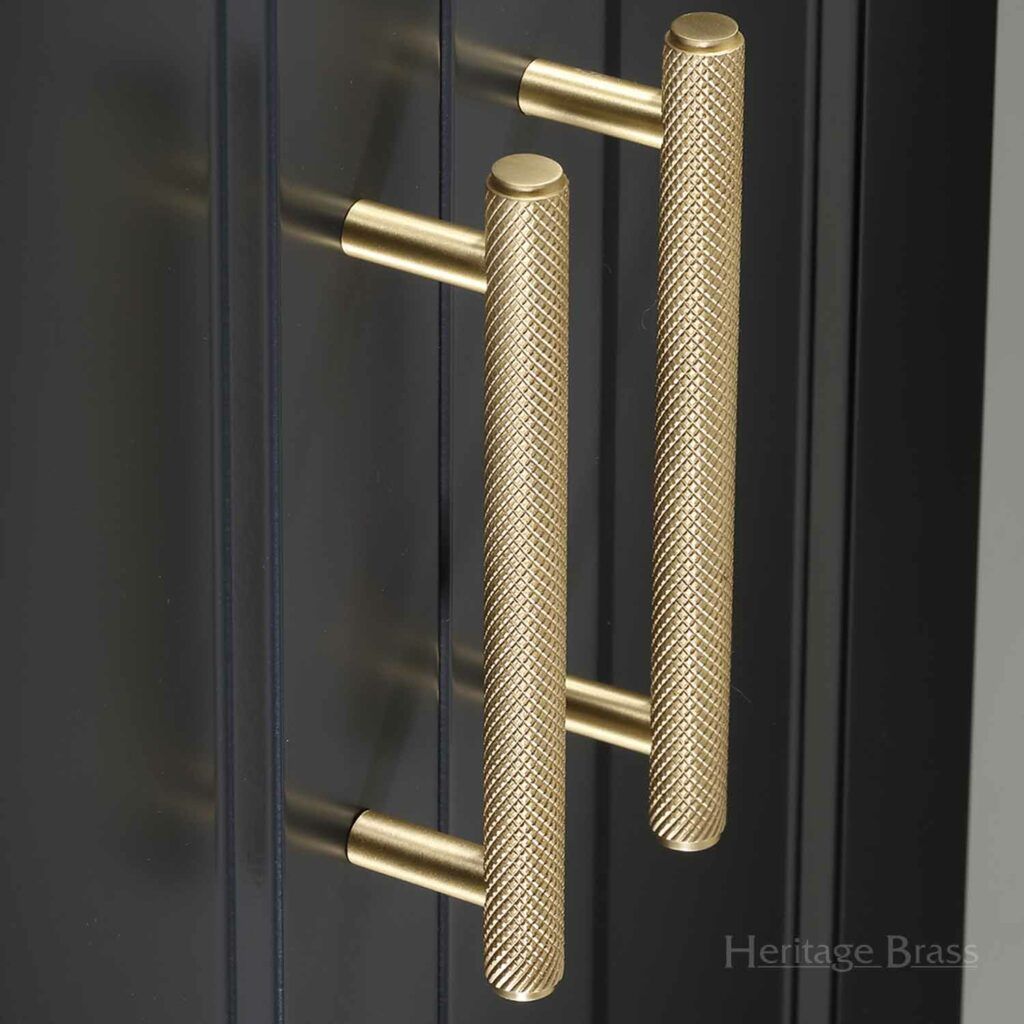 M. Marcus Heritage Brass Knurled Cupboard Pull Handle in Satin Brass on a charcoal cupboard front.